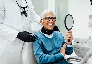 Senior woman smiling while looking at reflection