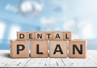 Blocks spell “dental plan”