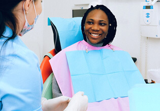 female patient speaking with her dentist