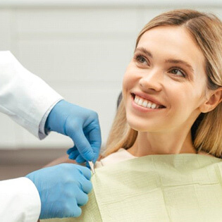 dental patient looking upward at dental team member