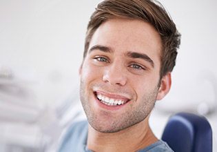 Young man smiling in dental chair