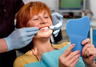 Woman examining her smile