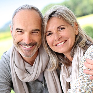 Senior couple smiling outdoors