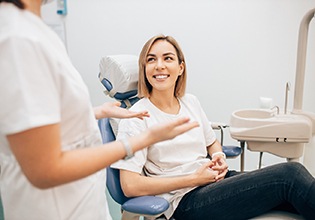 Patient smiling at cosmetic dentist in Ware