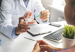 Cosmetic dentist in Ware showing patient model of teeth