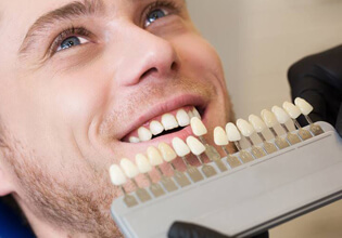 Color matching wheel in front of male smile