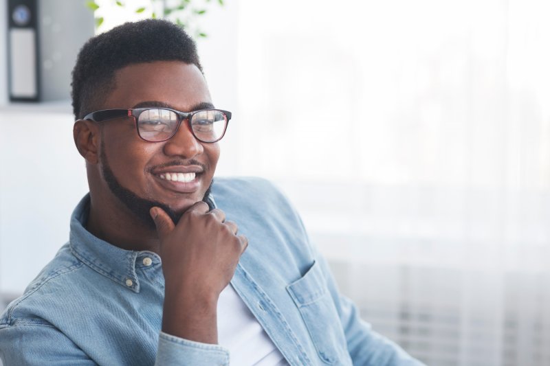 man considering how long cosmetic dentistry in Ware lasts