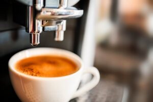 Espresso machine pouring a shot of espresso